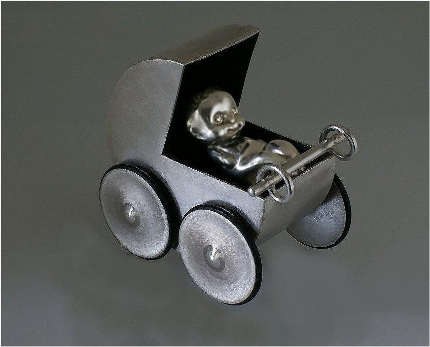 Pushable sterling silver pram and newborn baby